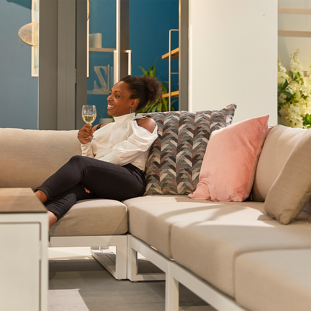 fabric corner sofa with woman drinking