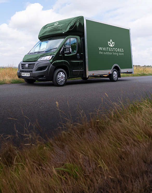 A White Stores delivery van parked on the road.