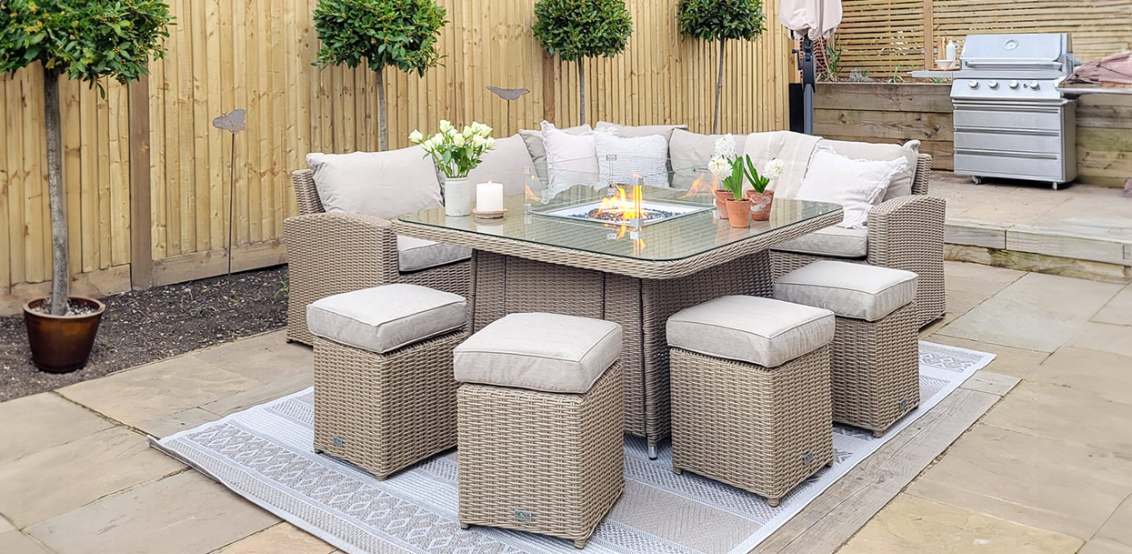 A rattan casual dining garden set with fire pit table, at a customers home.