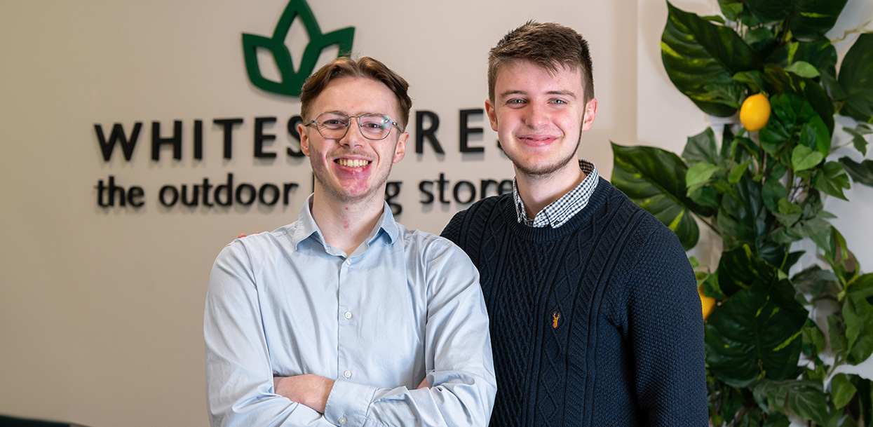 Headshot of two White Stores customer service employees, smiling.